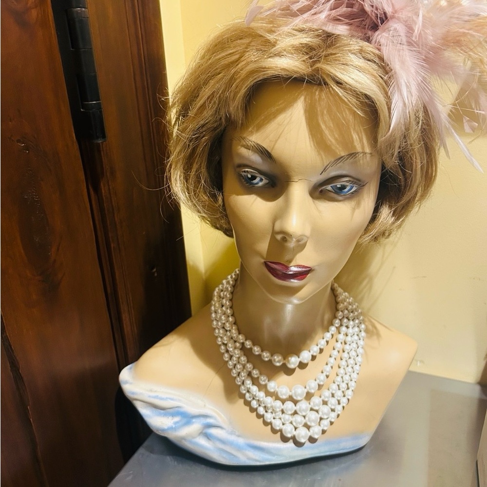 Elegant Blonde manniquin with Pink Feather Accessory